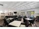 Community room features ample seating with tables, a TV, and a bar area perfect for social gatherings at 1860 Hill Chase, Alpharetta, GA 30022