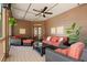 Comfortable covered patio with ceiling fan, and stylish wicker furniture with vibrant cushions at 1860 Hill Chase, Alpharetta, GA 30022