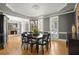 Stylish dining room with gray walls, white trim, and a modern chandelier is perfect for entertaining at 1860 Hill Chase, Alpharetta, GA 30022
