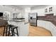 Stylish kitchen with modern appliances, white cabinets, and a breakfast bar is perfect for casual dining at 1860 Hill Chase, Alpharetta, GA 30022