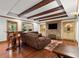 Relaxing living room with a stone fireplace and exposed wooden beams at 1860 Hill Chase, Alpharetta, GA 30022