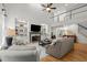 Open-concept living room with vaulted ceilings, a cozy fireplace, and stylish furnishings at 1860 Hill Chase, Alpharetta, GA 30022