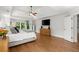 Spacious main bedroom with tray ceiling, wood floors, large windows, and walk-in closet at 1860 Hill Chase, Alpharetta, GA 30022