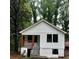 Charming home featuring a board and batten facade and a cute porch with wood columns and railings at 2004 Detroit Nw Ave, Atlanta, GA 30314