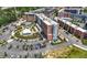 Beautiful aerial view of the complex featuring a pool, outdoor seating and nearby parking for easy access at 260 2Nd St, Fayetteville, GA 30214