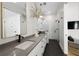 Modern bathroom with dual sinks, sleek fixtures, white tile, and a glass-enclosed shower at 260 2Nd St, Fayetteville, GA 30214
