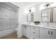 Modern bathroom with double vanity, sleek mirrors, modern lighting, and a glass-enclosed shower at 260 2Nd St, Fayetteville, GA 30214