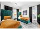 Bright bedroom featuring two twin beds with teal headboards, gold bedding, and stylish black and white curtains at 260 2Nd St, Fayetteville, GA 30214