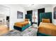 Modern bedroom featuring two twin beds with teal headboards, gold bedding, and designer rug at 260 2Nd St, Fayetteville, GA 30214