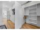 Walk-in closet with custom shelving and hardwood flooring for organized storage at 260 2Nd St, Fayetteville, GA 30214