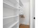 Walk-in closet with ample shelving and storage, providing an organized solution for clothes and personal items at 260 2Nd St, Fayetteville, GA 30214