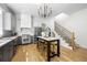 Stylish kitchen with stainless steel appliances, a modern island, and hardwood flooring at 260 2Nd St, Fayetteville, GA 30214