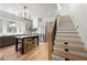 Open kitchen boasts a central island with seating, stainless appliances, and light-filled windows at 260 2Nd St, Fayetteville, GA 30214