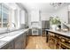 Bright, modern kitchen with stainless steel appliances, an island, and hardwood flooring at 260 2Nd St, Fayetteville, GA 30214