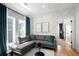 Comfortable living room featuring modern sofa, and hardwood floors at 260 2Nd St, Fayetteville, GA 30214