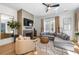 Living room featuring hardwood floors, a modern fireplace, and comfortable seating at 260 2Nd St, Fayetteville, GA 30214