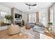 Bright and airy living room with hardwood floors, a fireplace, and a comfortable seating area at 260 2Nd St, Fayetteville, GA 30214