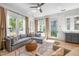 Sun-filled living room with hardwood floors, a comfortable sectional sofa, and neutral decor at 260 2Nd St, Fayetteville, GA 30214