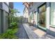 A cozy outdoor patio with a seating area, decorative gravel, and access to the main entrance at 260 2Nd St, Fayetteville, GA 30214
