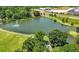 Scenic aerial view of a pond with a fountain, surrounded by walking paths and trees at 260 2Nd St, Fayetteville, GA 30214