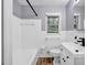 Clean bathroom with white tile, classic fixtures, and a vanity at 2921 Country Squire Ln, Decatur, GA 30033