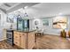 Modern kitchen with an island and bar stools open to the dining and living areas at 2921 Country Squire Ln, Decatur, GA 30033