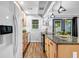 Modern kitchen features granite countertops, stainless steel appliances, and stylish pendant lighting at 2921 Country Squire Ln, Decatur, GA 30033