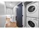 Convenient laundry area with a stackable washer and dryer and an adjacent room at 2921 Country Squire Ln, Decatur, GA 30033