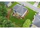 Aerial view of a home with a large backyard, wooden deck, patio furniture, and lush green grass at 927 Ivey Chase Pl, Dacula, GA 30019