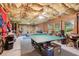 Unfinished basement with insulation, open ceilings, a ping pong table, and potential for customization at 927 Ivey Chase Pl, Dacula, GA 30019