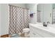 Clean bathroom with white vanity and tiled shower at 927 Ivey Chase Pl, Dacula, GA 30019