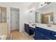 Main bathroom featuring a walk-in shower and double sinks at 927 Ivey Chase Pl, Dacula, GA 30019