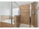 Beautiful bathroom featuring a separate shower and soaking tub, with neutral-toned tile surround and glass doors at 927 Ivey Chase Pl, Dacula, GA 30019