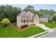 Lovely two-story home featuring brick accents, manicured lawn, and a two-car garage at 927 Ivey Chase Pl, Dacula, GA 30019