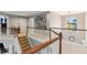 Upstairs foyer featuring hardwood banisters and a large window at 927 Ivey Chase Pl, Dacula, GA 30019