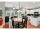 Bright eat-in kitchen features white cabinets, granite counters, and stainless steel appliances at 927 Ivey Chase Pl, Dacula, GA 30019