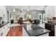 Open kitchen with granite counters and clear view to the living room and staircase at 927 Ivey Chase Pl, Dacula, GA 30019