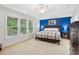 Spacious main bedroom with a ceiling fan and a large window for natural light at 927 Ivey Chase Pl, Dacula, GA 30019