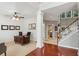 Spacious office area featuring natural light, carpet floors, and a large desk at 927 Ivey Chase Pl, Dacula, GA 30019
