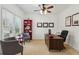 Bright and airy office space with large windows, neutral walls, and a comfortable seating area at 927 Ivey Chase Pl, Dacula, GA 30019