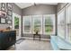 Relaxing sunroom with many windows offering great natural light at 927 Ivey Chase Pl, Dacula, GA 30019