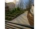 Professionally landscaped backyard with retaining walls and walkway creating a serene outdoor space at 240 Patterson Se Ave, Atlanta, GA 30316