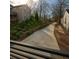 Professionally landscaped backyard with retaining walls and walkway creating a serene outdoor space at 240 Patterson Se Ave, Atlanta, GA 30316