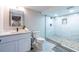 Modern bathroom featuring updated tile, river rock flooring, and a glass shower at 240 Patterson Se Ave, Atlanta, GA 30316