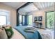 Modern bedroom featuring a comfortable bed, stylish rug, and windows with a natural view at 240 Patterson Se Ave, Atlanta, GA 30316