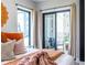 Modern bedroom featuring a comfortable bed, stylish rug, and sliding glass door with outside patio at 240 Patterson Se Ave, Atlanta, GA 30316