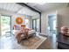 Modern bedroom featuring a comfortable bed, stylish rug, and sliding glass door with outside patio at 240 Patterson Se Ave, Atlanta, GA 30316