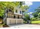 Modern, multi-level home featuring balconies, a two-car garage, and unique architectural details at 240 Patterson Se Ave, Atlanta, GA 30316
