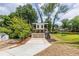 Modern two-story home featuring a striking minimalist design, balcony, with a large driveway at 240 Patterson Se Ave, Atlanta, GA 30316