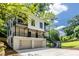Modern two-story home with balconies, garage, and staircase, showcasing contemporary design and curb appeal at 240 Patterson Se Ave, Atlanta, GA 30316